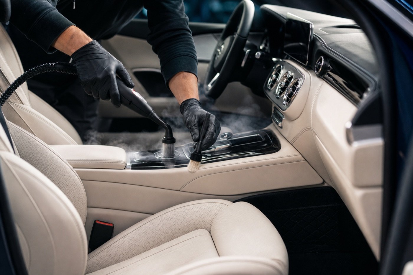 Professional steam cleaning of a luxury cream leather interior